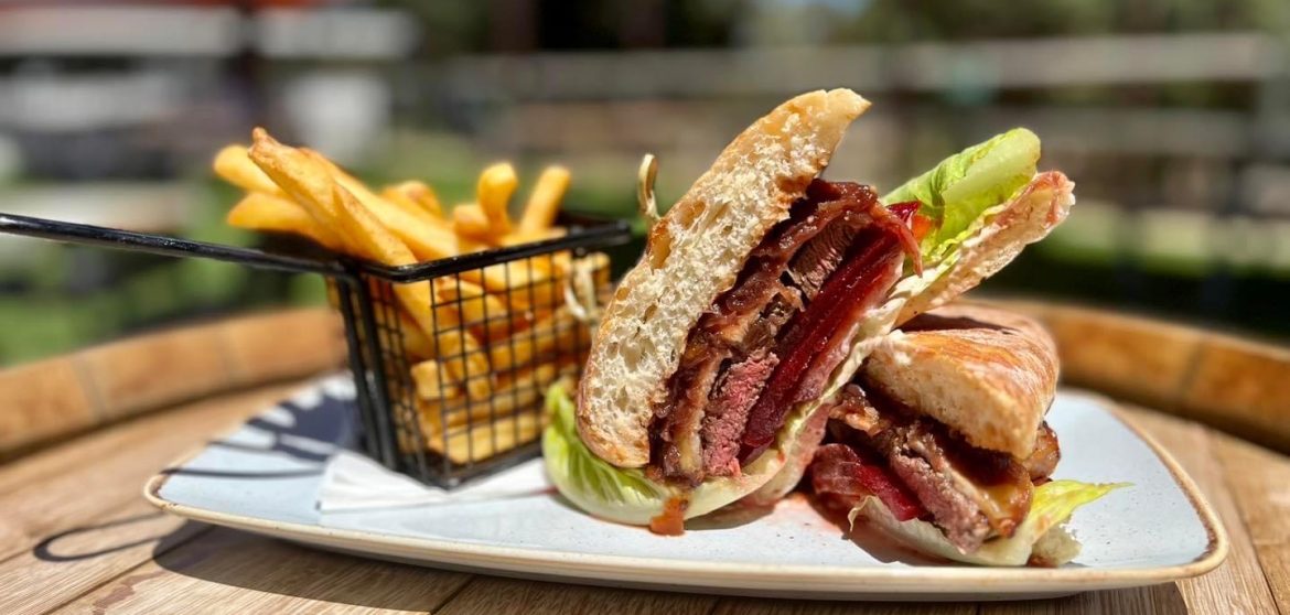 Burger and fries served on a plate